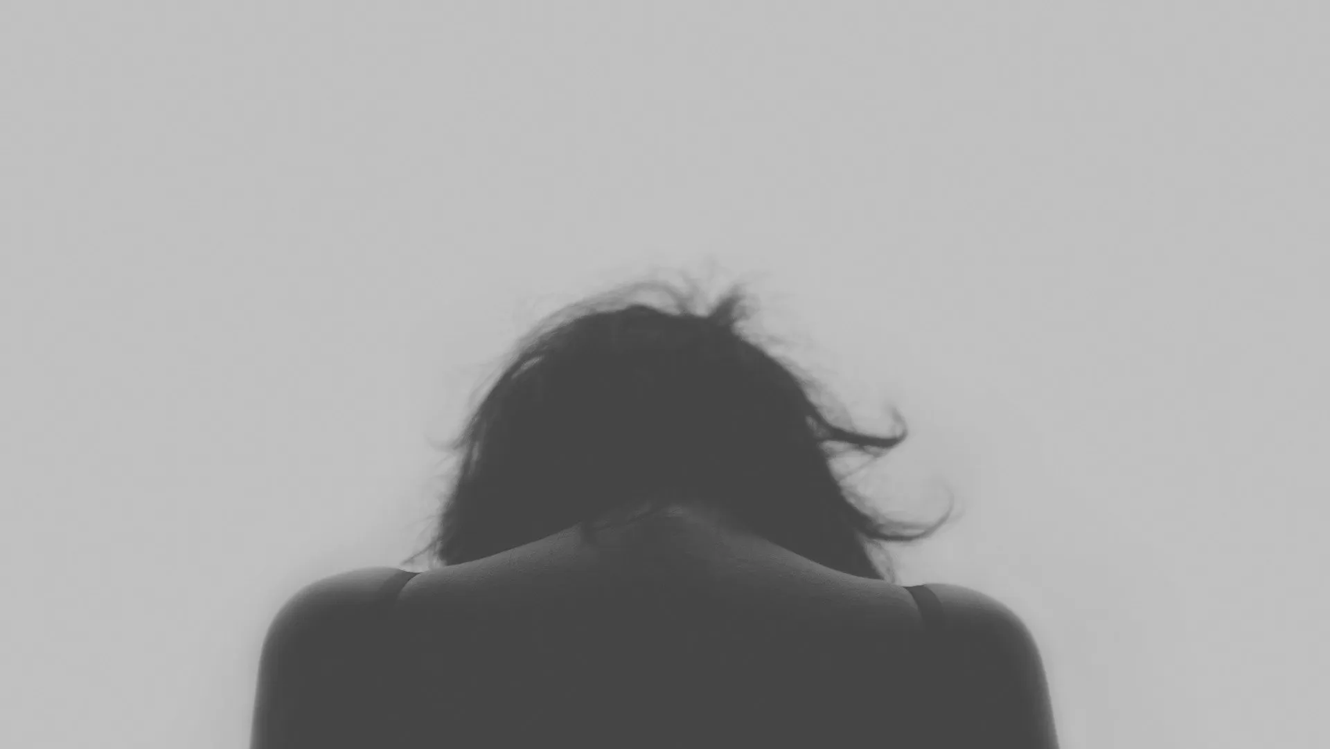 Depressed woman with shoulders slumped